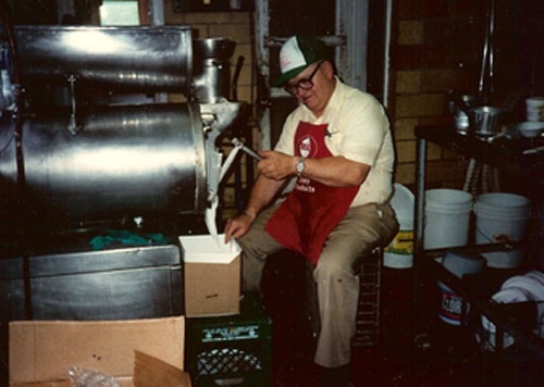 Hall's ice cream founder scooping a cone at the window